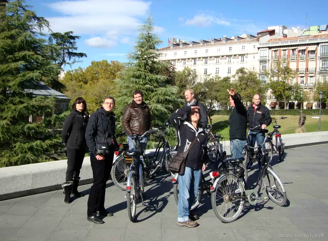 Local guide leading a Madrid bike tour through the historic center