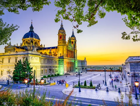 Guide leading a small group through the Royal Palace of Madrid